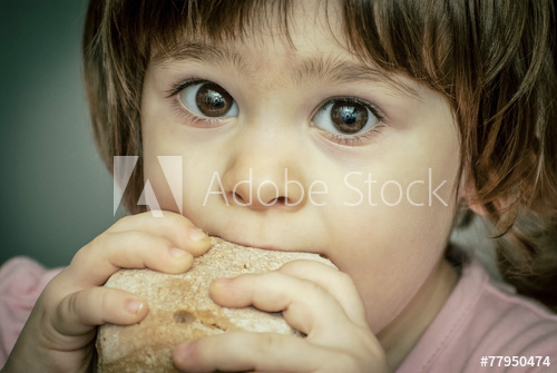 A child eating bread 