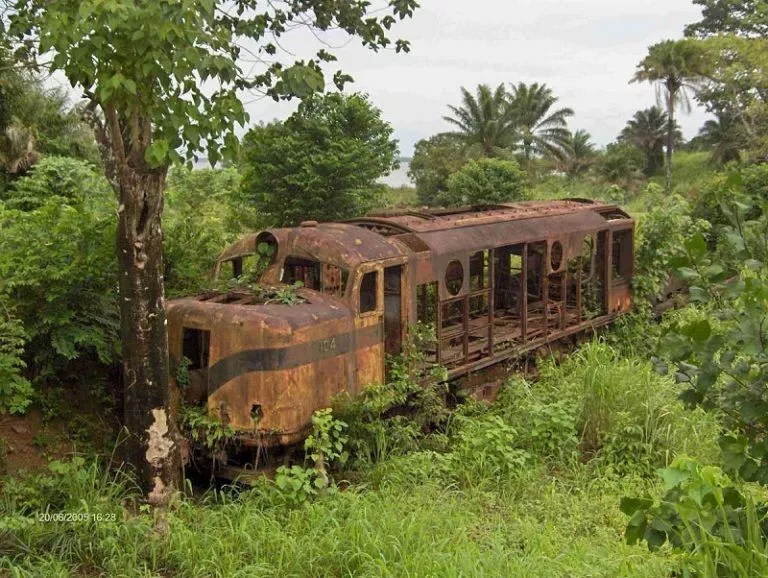 An old rusted train car abandoned in the jungle, symbolizing Corrosion Assignment Help concept