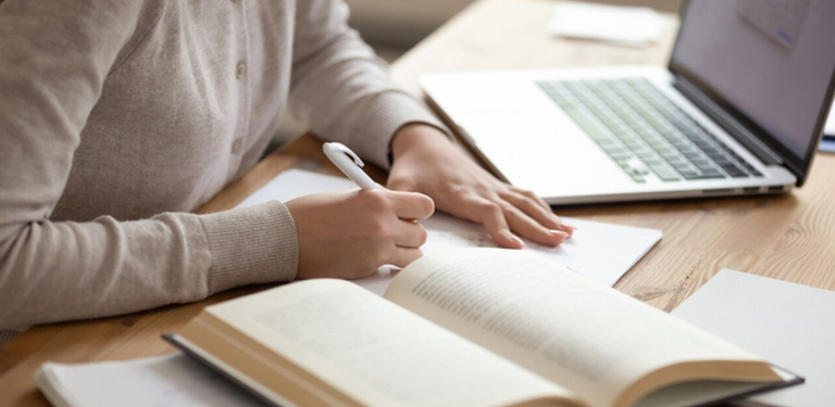 a diligent student appears to be engaged in dissertation writing tutoring session