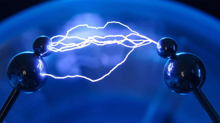 Two electric sparks in a blue light, representing the concept of Electricity Magnetism Homework Help