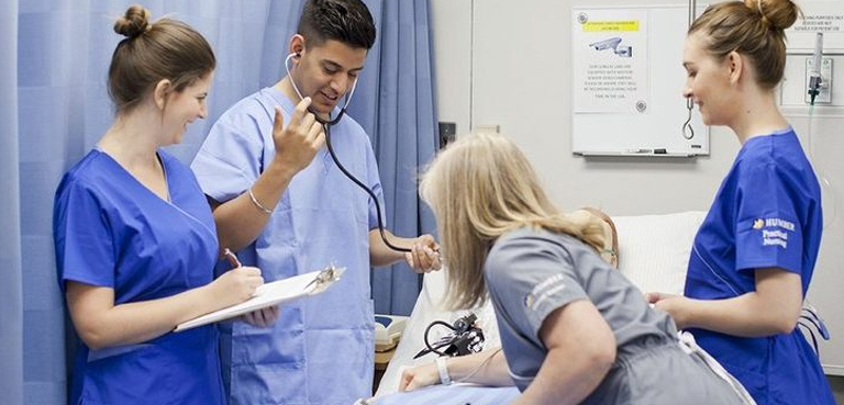 a group of medical students doing some checkups as a part of their assignment 