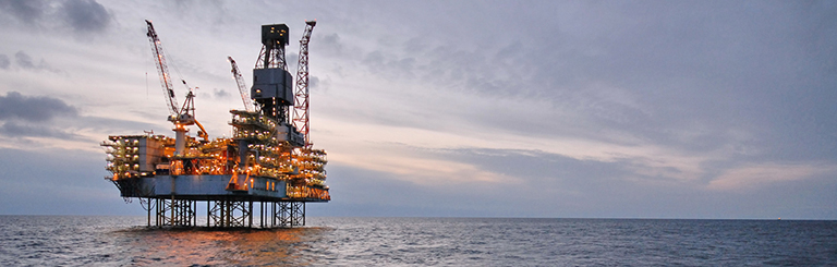 Oil rig in the ocean, symbolizing Petroleum Engineering Homework Help Concept