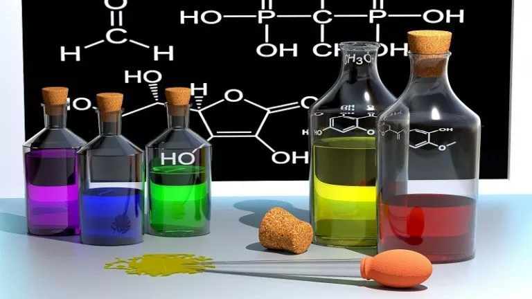 Glass bottles and chemicals in a chemistry lab, perfect for polymer chemistry homework help